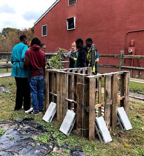 Photo of volunteers creating a compost bin