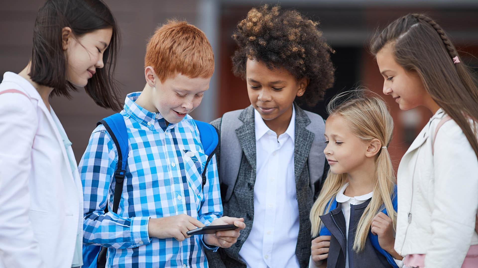 Youth looking at a cell phone