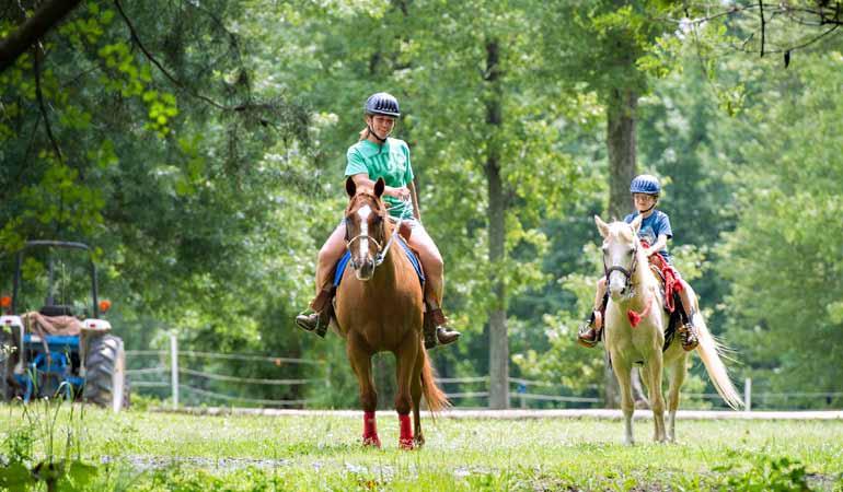 Two youth riding horses. Photo: MDA, Edwin Remsberg