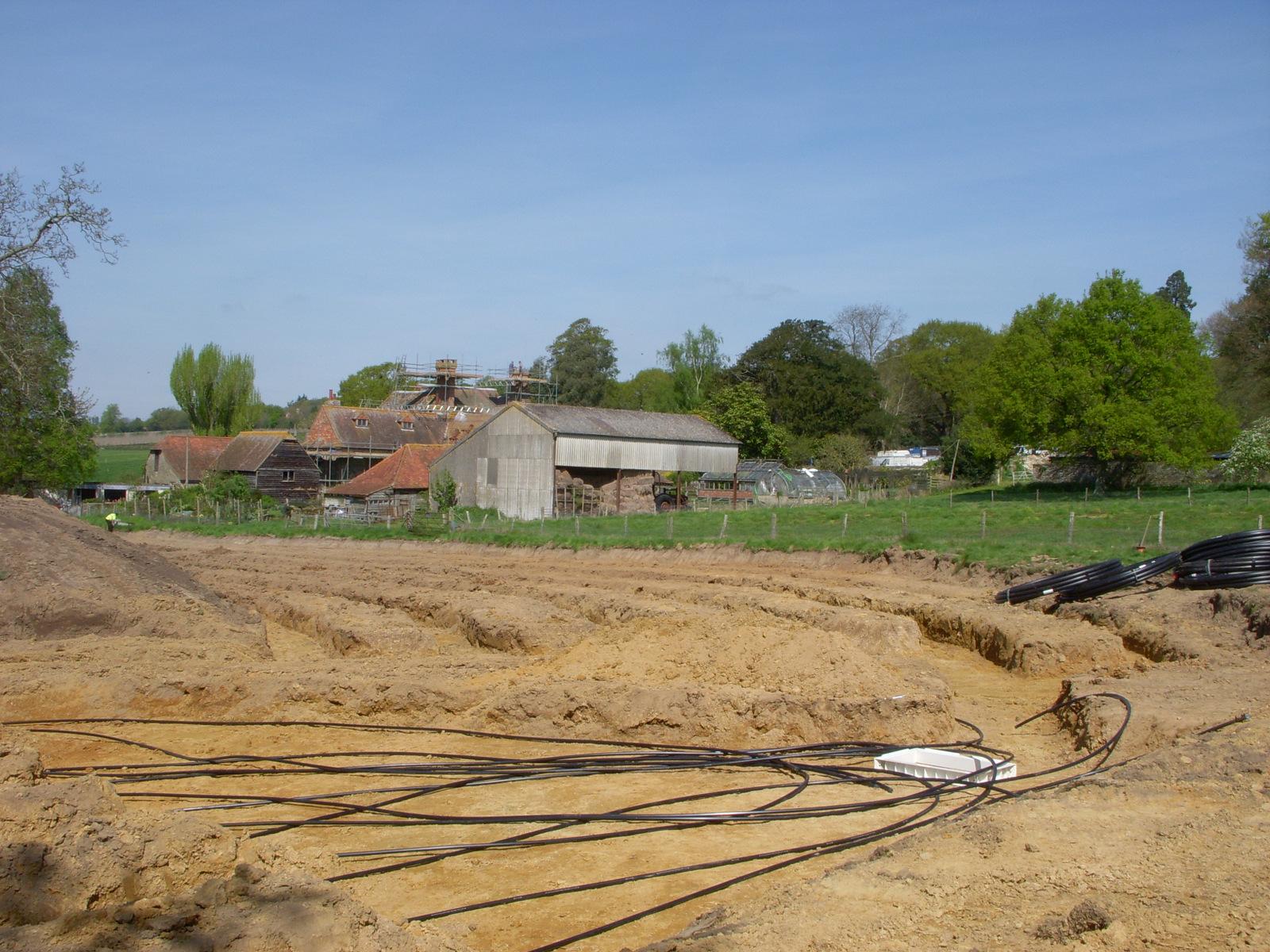 Ground Source Heat Pump Tubing in Field Trenches