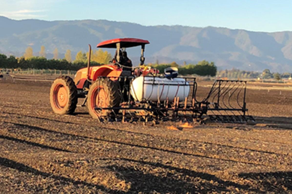 Fig. 1. Tractor equipped with propane tank and burners. Attribute: Ian Abbott (CC)