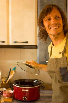 man preparing to use a crock pot