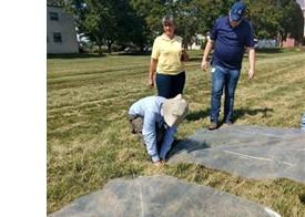 Figure 1. Setting out plastic for manure spreader calibration. 